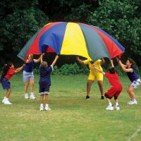 kids playing with parachute on grass
